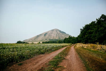the road goes away to the mountain. Russia, mountain of yuraktau Sheehanの写真素材