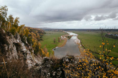 White rock on the river. Autumn landscape in the southern Urals. Aktash rock on the Zilim river....