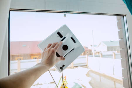 robot automatic window cleaning, robot cleaner, clean Windows in the house, robot washes glass on...