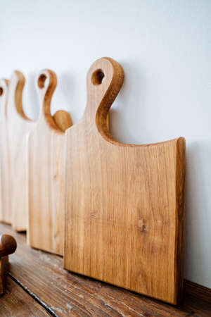 cutting board. carpentry workshop for the manufacture of wooden boards for the kitchen. kitchen utensils, a set of boards for cooking. High quality photoの写真素材