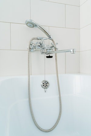 Snow-white bathroom with shower. Minimalist bathroom in a modern style. Light walls decorated with tiles. High quality photoの写真素材