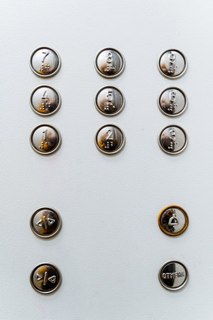 A close shot of the multi-function elevator button panel. On the button of the inscription for the blind. Go to the desired floor by elevator. high quality photoの写真素材