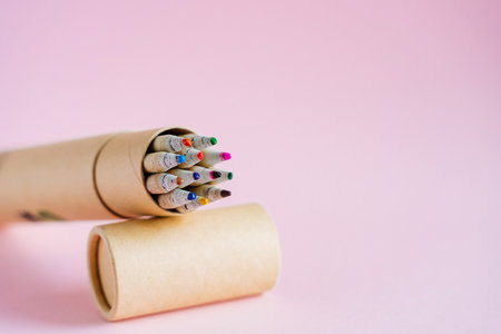 A set of colored pencils on a pink background. Draw with bright colored pencils. Pencils made of natural wood. Drawing and fantasizing. high quality photoの写真素材