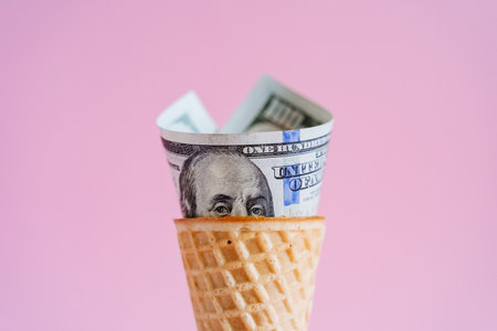 Benjamin Franklin peeks out of a waffle cone, hundred dollars in a waffle cone. Unusual ice cream on...
