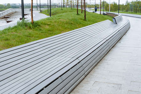 Designer bench in the city park, a place to sit, a bench for relaxing in the fresh air, a product...
