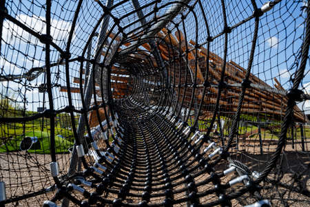 Cobweb children's playground, tunnel for climbing kids, black nylon rope rope, mesh with cells. high...