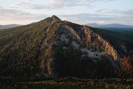 Triangular rock light falls on the stones, evening lighting of the mountain, sunset sun, mountain in the southern Urals of Russia Bashkortostan. high quality photoの写真素材