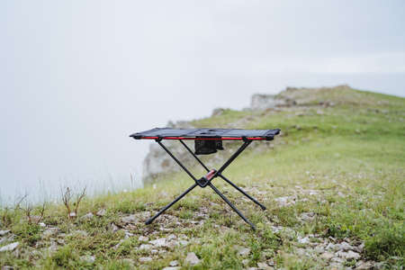 Small size frame table for camping, furniture made of light materials, trekking in the mountains,...