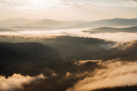 Mountain landscape, morning sun fog in the mountains, smoke filled the lowlands of the river, golden dawn, beauty of nature, Russia, taiga, Southern Urals Bashkortostanの写真素材