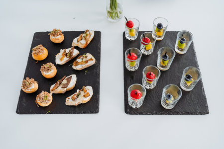 Table setting with snacks in a cup top view, varied menu, food treat in the office, food on a white background. High quality photoの写真素材