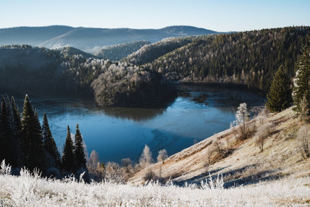 Beautiful mountain landscape, blue lake water, winter forest, high-altitude pond. High quality photoの写真素材
