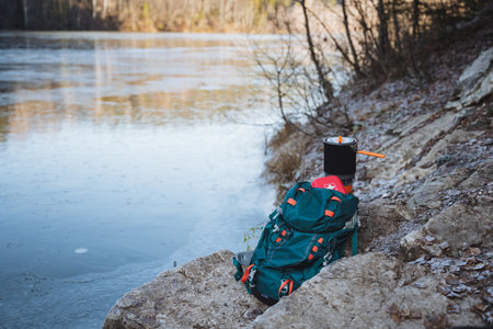 Camping equipment for hiking in the mountains, a first aid kit is in the backpack, there is a pot for cooking on a hike or expedition. High quality photoの写真素材