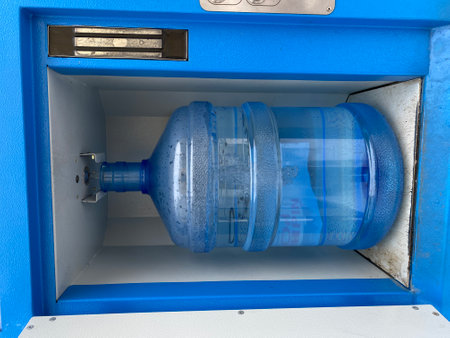 Clean bottled water from a vending machine, a bottle of spring water, health care, paid water. Robot...