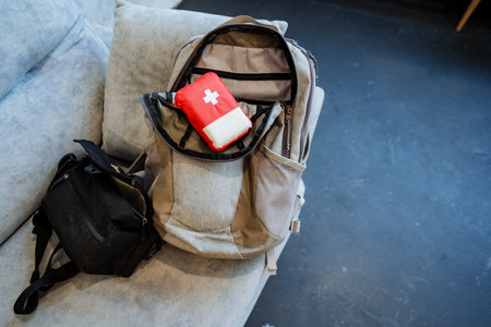 A small first aid kit for a traveler, packing for the trip, packing things in a backpack, a set of...