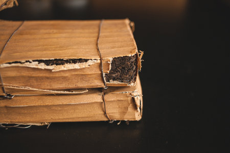 A stack of rectangular cardboard boxes, resembling plywood, tied with hardwood string. Could be repurposed for a musical instrument accessory, table, flooring, or varnished for an event displayの写真素材