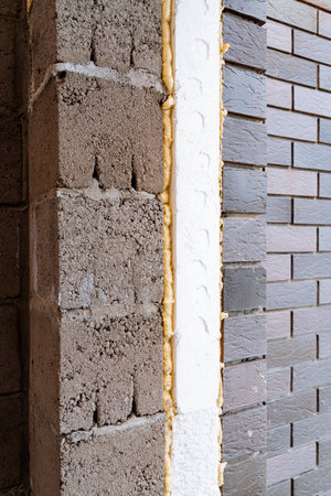 A close up of a brick wall with foam on itの写真素材
