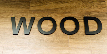 The word wood is on a wooden surfaceの写真素材