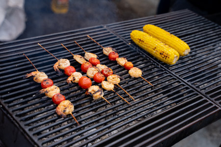 These grilled skewers feature succulent shrimp, juicy cherry tomatoes, and sweet corn, perfect for...