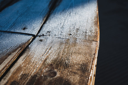 A beautiful closeup view of a rustic wooden tableの写真素材