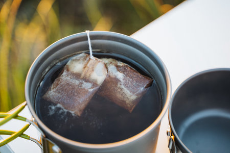 As two tea bags are steeped in hot water, they create a truly soothing moment, offering a refreshing and delightful beverage that brings warmth and peace to your dayの写真素材