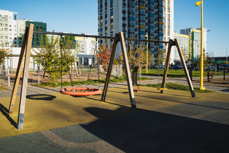 Imagine a lively and vibrant playground brimming with swings, beautifully set against a stunning...
