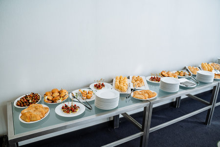 An elegantly set table is beautifully adorned with a delightful and inviting array of delicious...