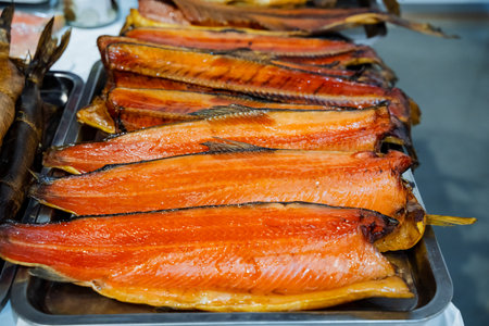 A beautifully arranged tray of highquality, smoked salmon delights guests, making it a perfect appetizer and excellent meal choice for special occasions and festive gatheringsの写真素材