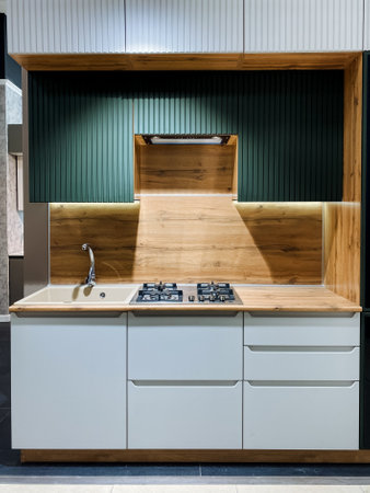 This modern kitchen design features elegant wooden accents combined with a highly functional layout, creating a perfect blend of aesthetics and practicality for everyday useの写真素材