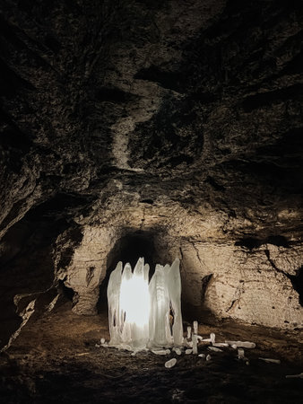 A cave with a light in the middle of itの写真素材