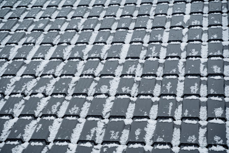 This captivating image shows a closeup of a snowcovered roof, showcasing a serene winter landscape and enhancing the beauty of the scene, inviting appreciation of winters eleganceの写真素材