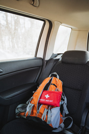 In the back seat of this vehicle, theres a wellorganized backpack and a fully stocked first aid kit, ready for any unexpected outings or emergencies that may arise during travelの写真素材