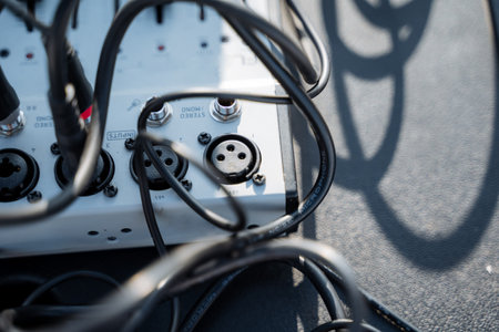 A multitude of wires and cables are connected to a device, showcasing a complex network essential for its effective operation, ensuring seamless performance, efficiency, and reliabilityの写真素材