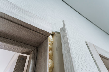 This captivating closeup shot showcases a door, beautifully detailed, with foam oozing out, creating...