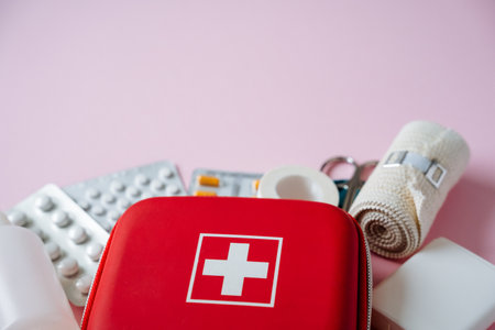 A vibrant first aid kit, complete with essential medical supplies, is perfect for ensuring home safety and travel preparedness. Stay ready for any emergencies at any time, anywhereの写真素材