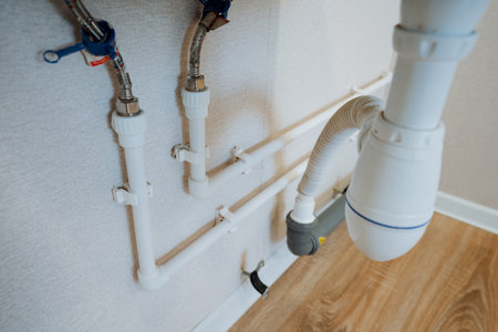 This image provides a detailed closeup view of a bathroom sink pipe, emphasizing crucial plumbing...