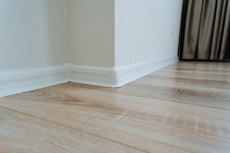 In one corner of the room, there exists a beautifully designed area featuring a wellfinished wooden...