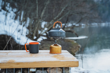 A beautifully crafted wooden table that features two cups placed on it, creating a cozy and warm atmosphere. Perfect for a setting in a kitchen or dining spaceの写真素材