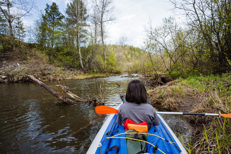 Experience the unmatched joy of a calming kayaking adventure amid lush greenery and serene,...