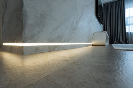 The room features a beautifully crafted wooden floor and a softly lit wall, creating a warm, inviting atmosphere. The design enhances both comfort and aesthetic appeal for its occupantsの写真素材