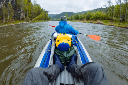 Experience the thrill of kayaking on a serene river surrounded by lush greenery and stunning landscapes. This outdoor adventure caters to nature lovers and adrenaline seekers alikeの写真素材