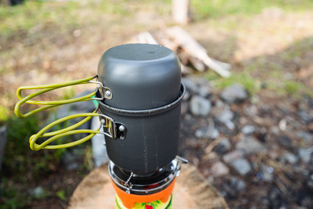 This lightweight, durable camping cooking set is perfect for outdoor enthusiasts. It's designed for easy packing and carrying on hiking and camping trips, ideal for adventures in natureの写真素材