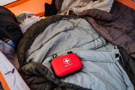 When you go camping, its vital to pack essential gear such as a cozy sleeping bag for those warm, inviting nights and a compact first aid kit to ensure safety during all your outdoor activitiesの写真素材
