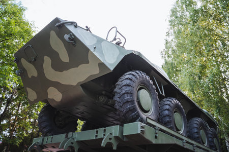 A military all-terrain vehicle showcased under a clear sky, featuring a unique camouflage pattern. Ideal for military vehicles, outdoor adventures, and tactical operations imagery.の写真素材