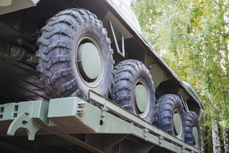 A variety of tires is showcased on a military vehicle, highlighting the important rubber components that enhance its functionality, performance, and efficiency in various conditionsの写真素材