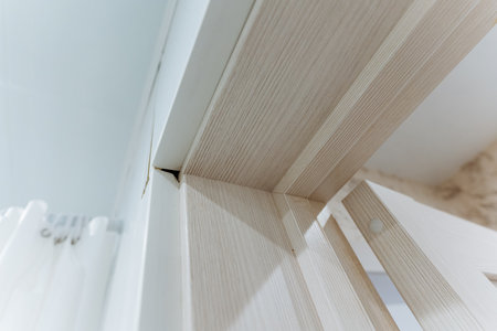 This closeup image showcases the sleek lines and unique textures of a captivating wooden architectural element, highlighting exceptional craftsmanship and innovative design techniquesの写真素材