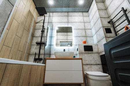 This beautifully designed bathroom features sleek, modern elements, stylish fixtures, a contemporary sink, and a spacious shower, providing a luxurious experience for all who enterの写真素材