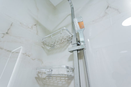 This is a detailed closeup view of a beautifully designed shower head installed in a modern bathroom...