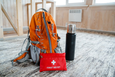 This vibrant orange backpack is perfect for adventure enthusiasts, featuring a stocked first aid kit...