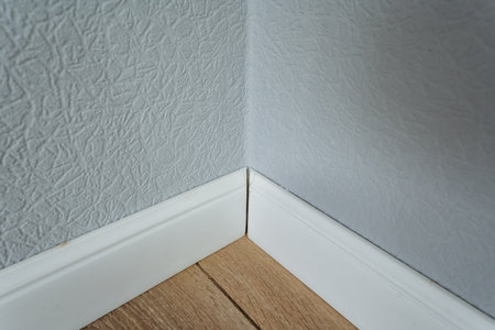 detailed molding checklist, baseboard and floor details verified, precise miter joints and smooth finish checked, all baseboard installations meet quality standards and precisionの写真素材