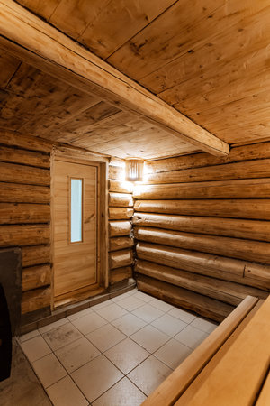 cozy sauna entry, inviting sauna with calming ambiance, relaxing sauna entrance featuring benches and gentle lighting, warm and welcoming sauna with comfortable seating and tranquilの写真素材